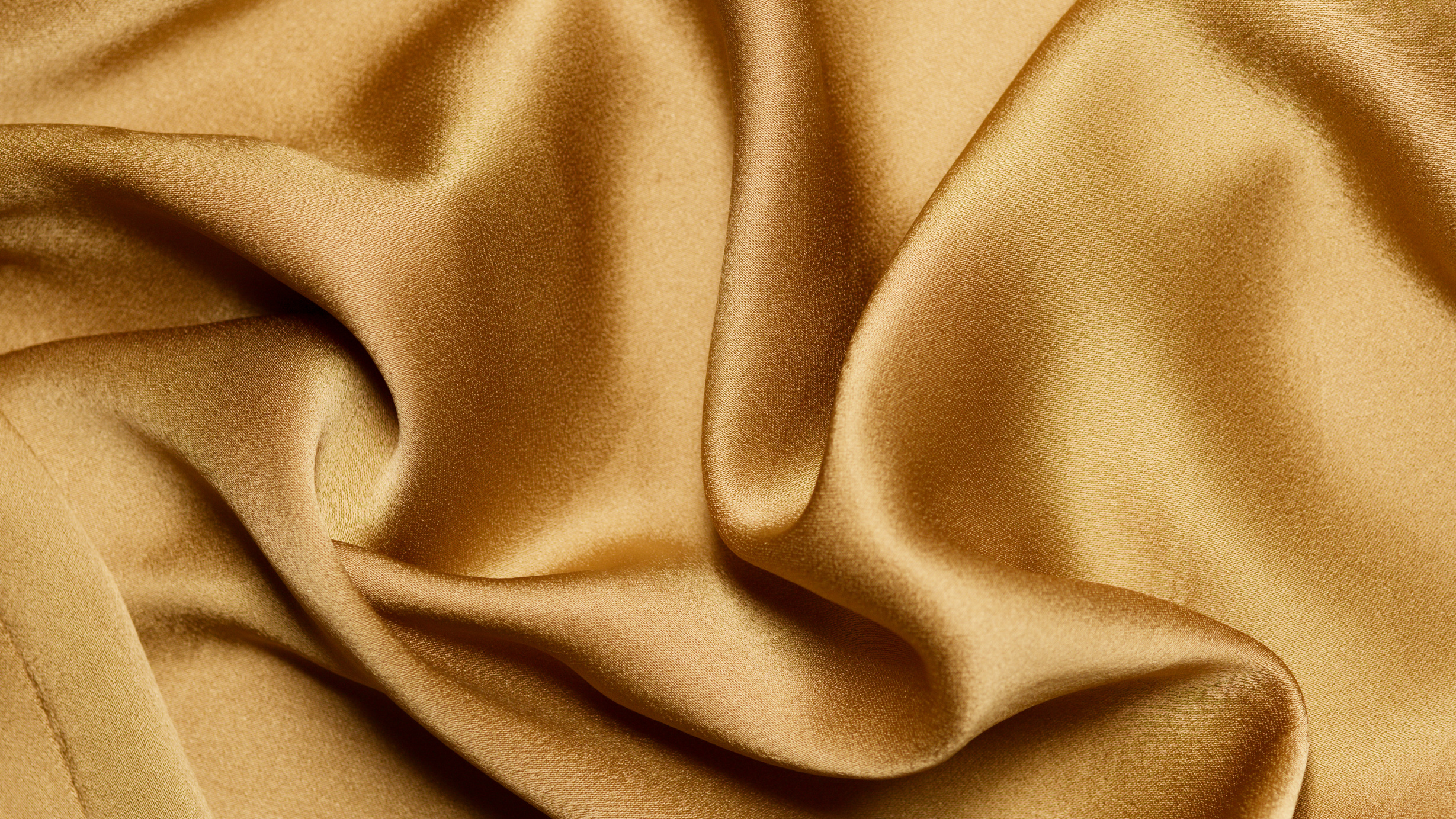 Close-Up Shot of a Gold Textile